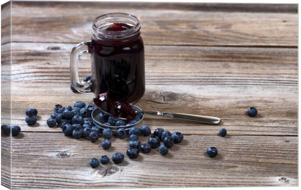 Fresh blueberry jam and berries with glass jar on  Canvas Print by Thomas Baker