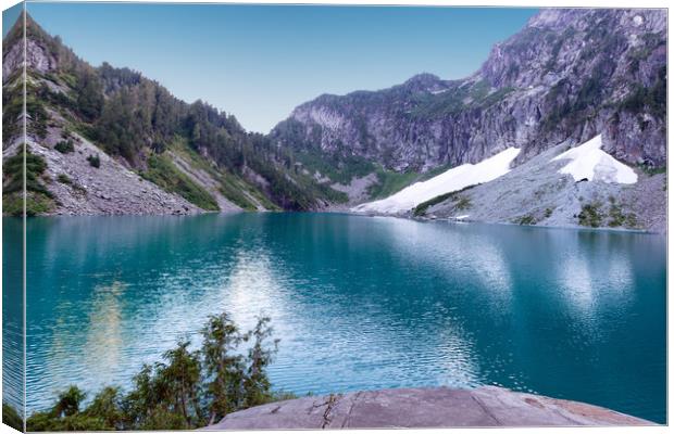 Glacier lake with mountains and snow during summer Canvas Print by Thomas Baker