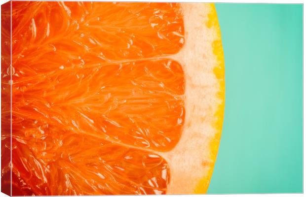 Blood Orange Slice Macro Details Canvas Print by Radu Bercan