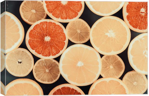 Orange, Grapefruit And Lemon Citrus Fruit Slices Canvas Print by Radu Bercan