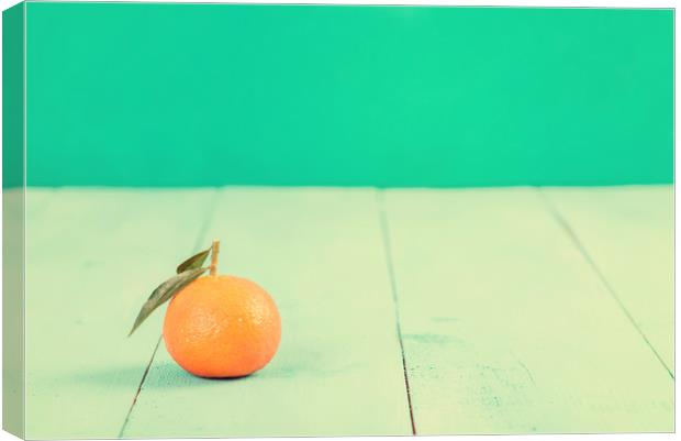 Fresh Tangerine On Blue Table Canvas Print by Radu Bercan