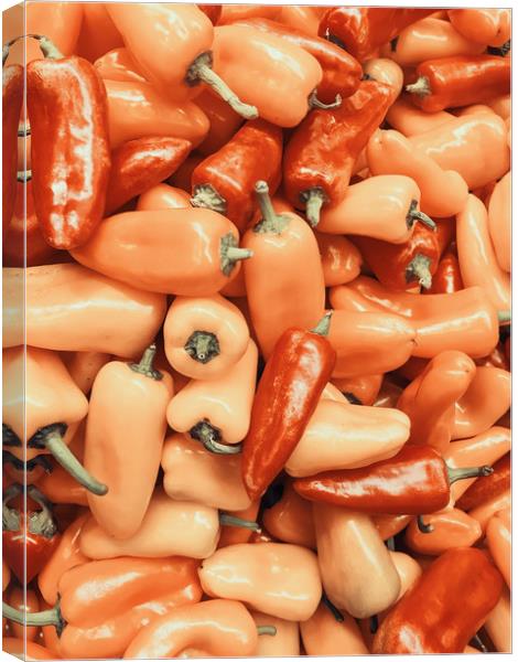 Red And Orange Capsicum In Vegetable Market Canvas Print by Radu Bercan