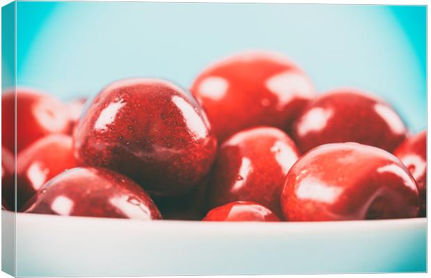White Bowl Of Fresh Red Cherries Canvas Print by Radu Bercan