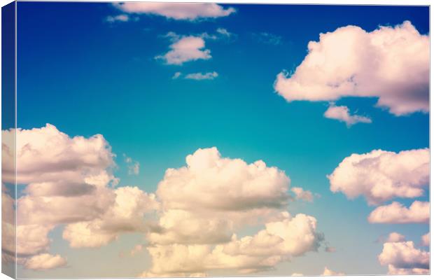 White Cumulus Clouds On Blue Sky Canvas Print by Radu Bercan