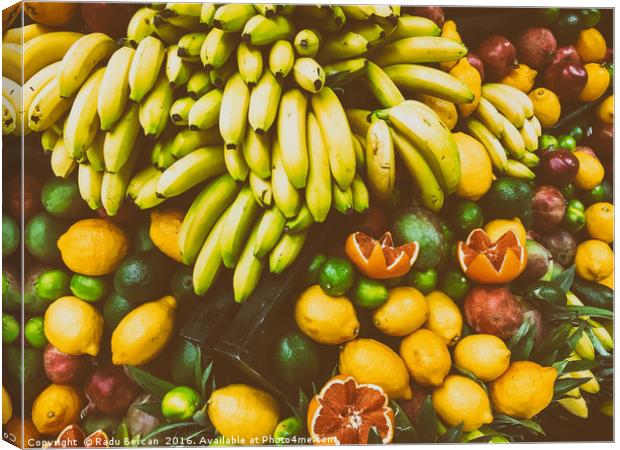 Tropical Summer Fruits In Fruit Market Canvas Print by Radu Bercan