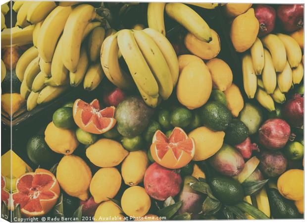 Tropical Summer Fruits In Fruit Market Canvas Print by Radu Bercan