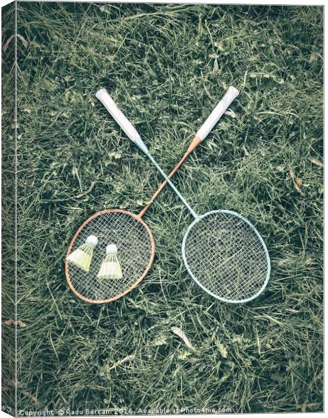 Badminton Racket And Shuttlecock Equipment In Gras Canvas Print by Radu Bercan