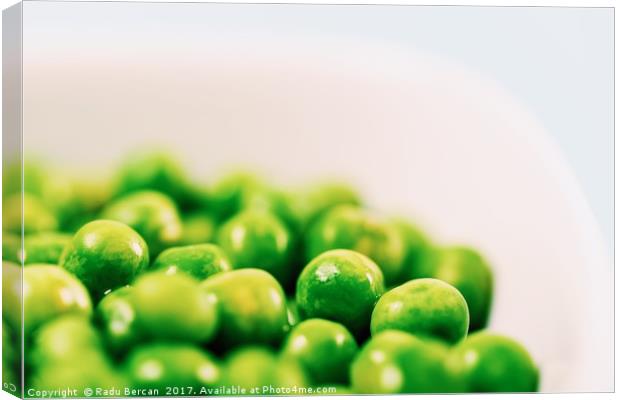 Fresh Green Peas In White Bowl On Turquoise Table Canvas Print by Radu Bercan