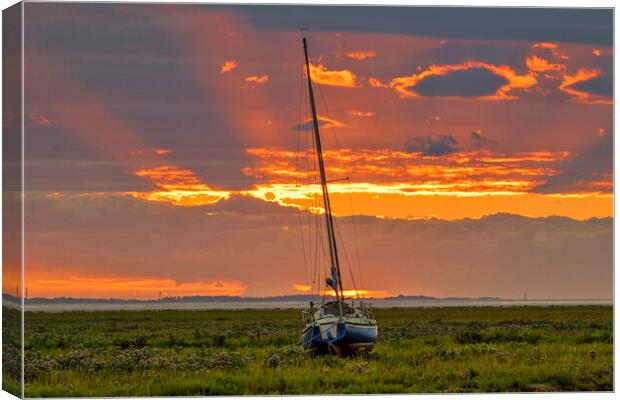 A sunset over a body of water Canvas Print by Kevin Elias