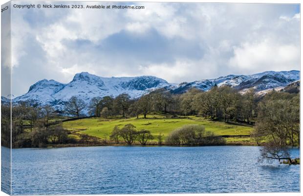 Langdale Pikes under Snow from Loughrigg Tarn Canvas Print by Nick Jenkins