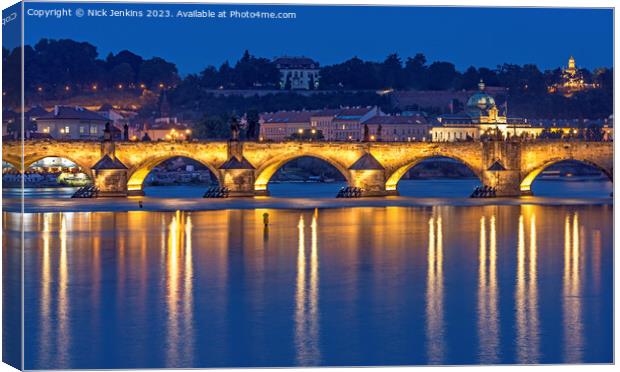 The Charles Bridge lit up over the Vltava River  Canvas Print by Nick Jenkins