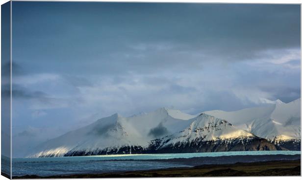 Snow Covered Mountains Iceland Canvas Print by Nick Jenkins