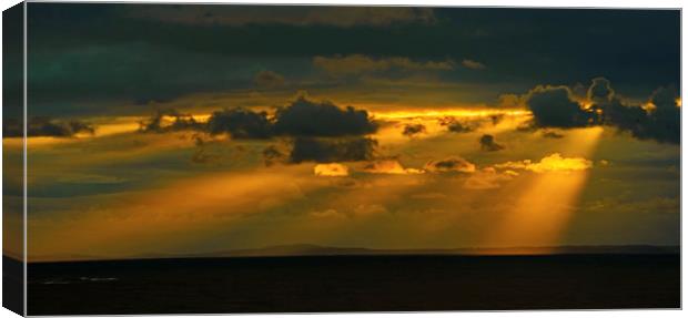 Sunbeams off Nash Point Canvas Print by Nick Jenkins