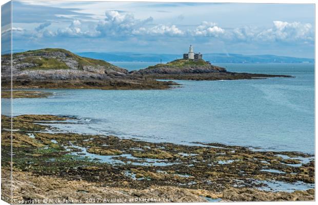 Mumbles Lighthouse Across Bracelet Bay Canvas Print by Nick Jenkins