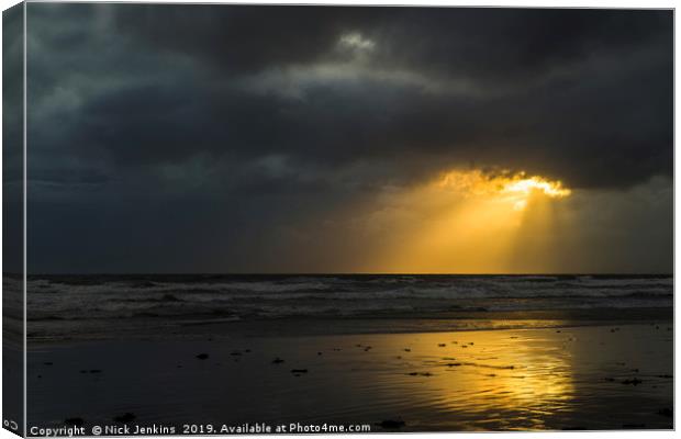 Sunlight through Dark Cloud South Wales coast Canvas Print by Nick Jenkins