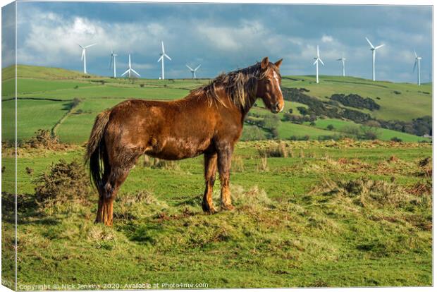 Brown Horse with backdrop of wind turbines south Wales  Canvas Print by Nick Jenkins