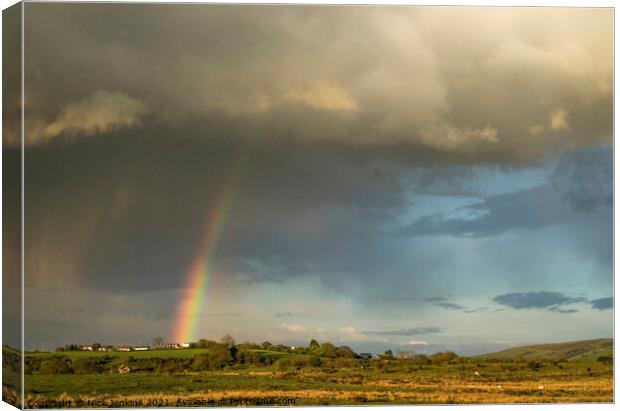 Rainclouds and Rainbow Llantrisant Common  Canvas Print by Nick Jenkins