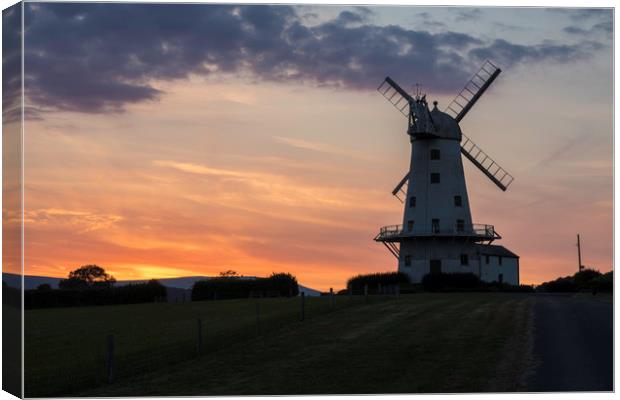 Llancayo windmill at sunset Canvas Print by Paul Huddleston