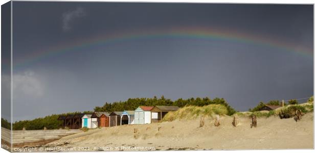 Rainbow and Beach Huts Canvas Print by Heidi Stewart