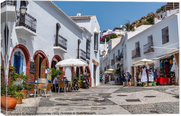 Tourists in Frigiliana in Andalusia, Spain Canvas Print by Angus McComiskey