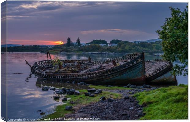 Abandoned fishing boats at Salen Bay at daybreak Canvas Print by Angus McComiskey