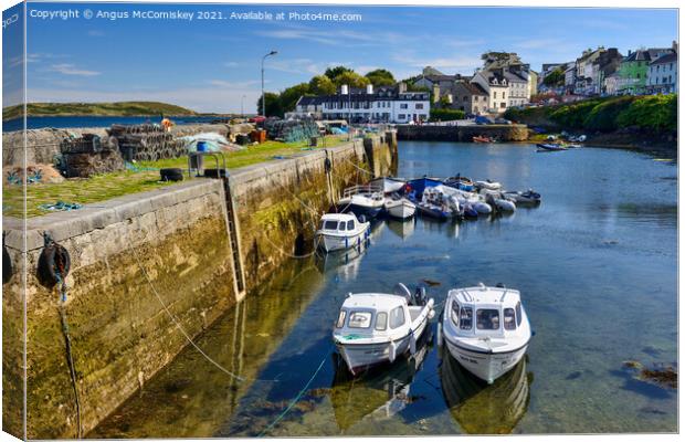 Boats tied up in Roundstone harbour, County Galway Canvas Print by Angus McComiskey