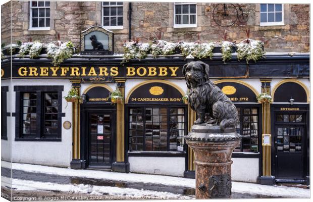 Statue of Greyfriars Bobby in snow, Edinburgh Canvas Print by Angus McComiskey