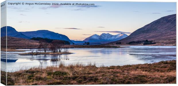 An Teallach viewed across frozen Loch Droma Canvas Print by Angus McComiskey