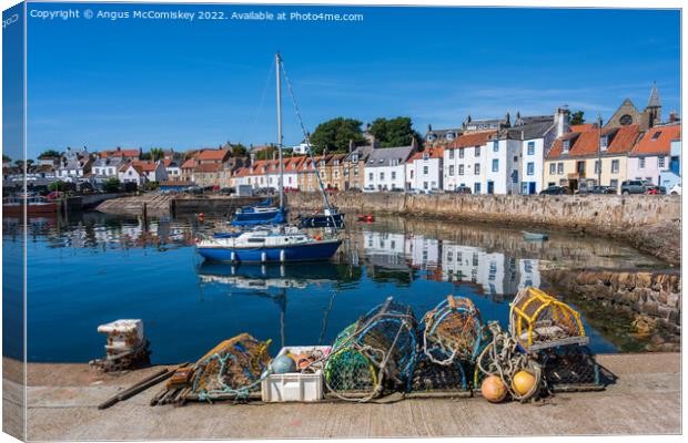 Lobster pots on quayside at St Monans harbour Canvas Print by Angus McComiskey