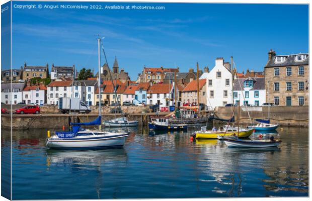 Boats moored in St Monans harbour Canvas Print by Angus McComiskey