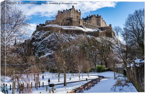 Edinburgh Castle from Princes Street Gardens snow Canvas Print by Angus McComiskey