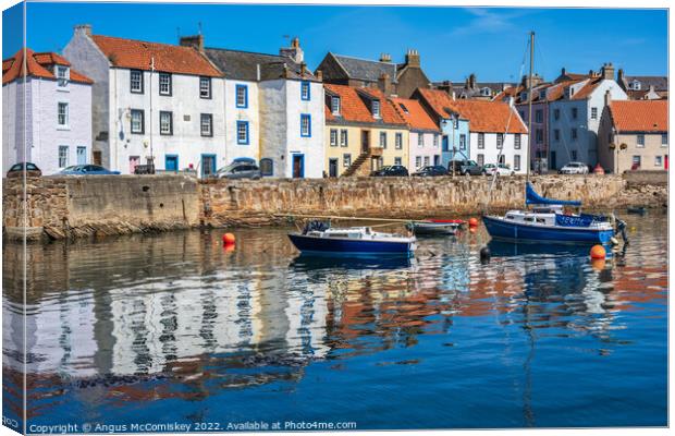 Colourful reflections in St Monans harbour Canvas Print by Angus McComiskey