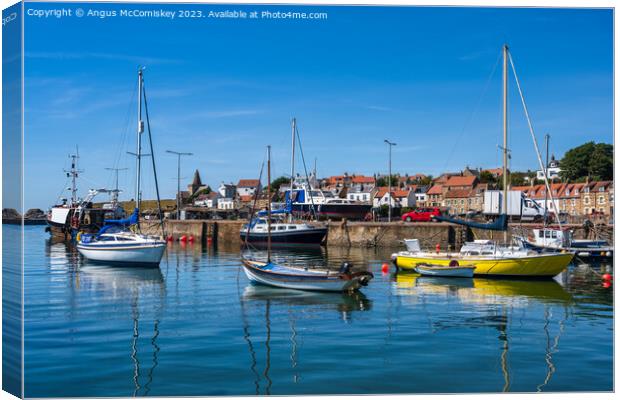 Colourful Boats moored in St Monans harbour Canvas Print by Angus McComiskey