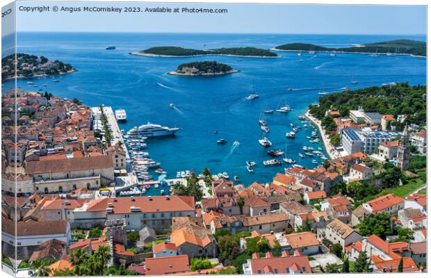 Aerial view of Hvar town and harbour, Croatia Canvas Print by Angus McComiskey