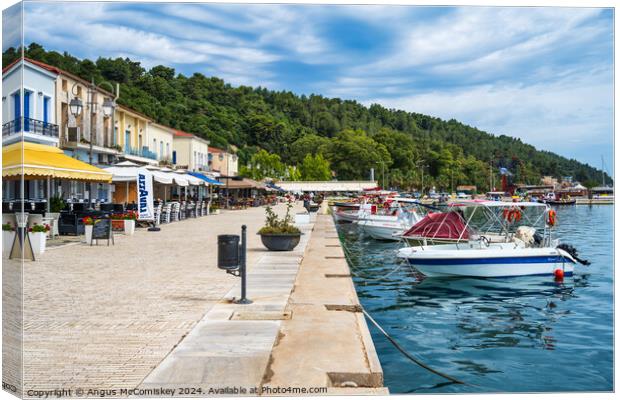 Boats moored on quayside of Katakolon, Greece Canvas Print by Angus McComiskey