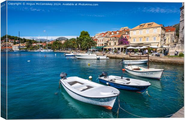 Boats tied up on waterfront of Cavtat in Croatia Canvas Print by Angus McComiskey