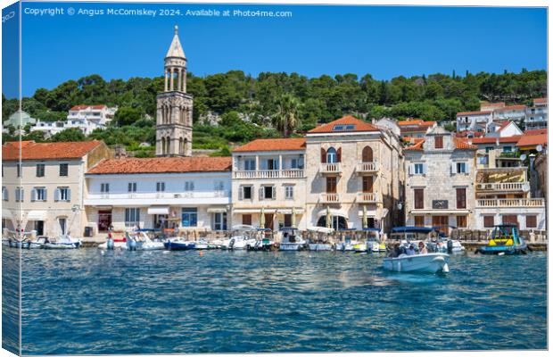 Boats on waterfront of Hvar town, Croatia Canvas Print by Angus McComiskey