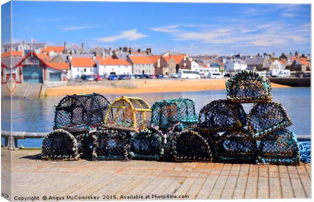 Lobster pots on quayside at Anstruther Canvas Print by Angus McComiskey