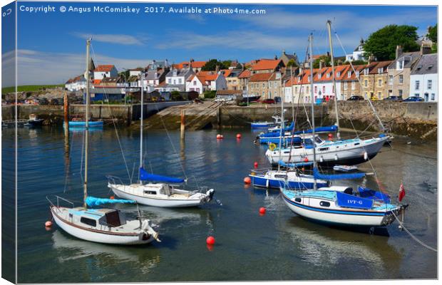 Yachts at anchor in St Monans harbour Canvas Print by Angus McComiskey