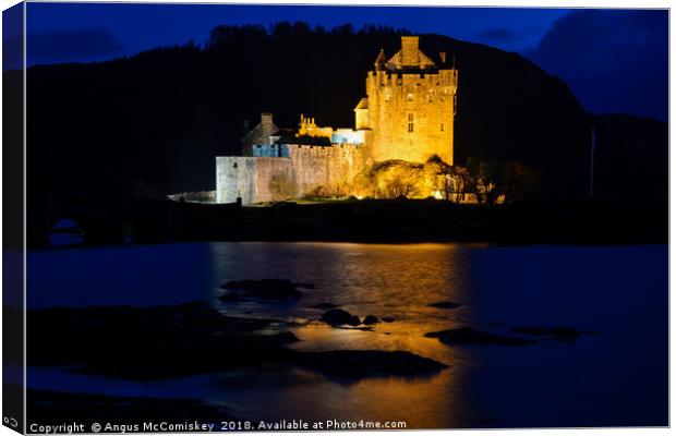 Eilean Donan Castle by night Canvas Print by Angus McComiskey