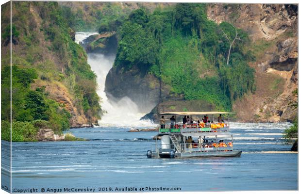 Tourist boat in front of Murchison Falls in Uganda Canvas Print by Angus McComiskey