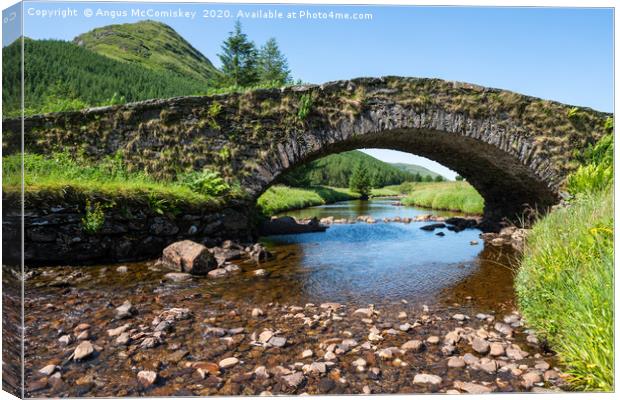 Butterbridge old stone single arched bridge Canvas Print by Angus McComiskey