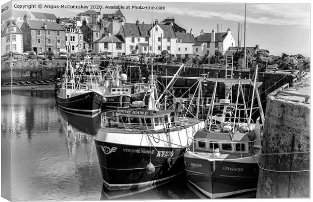 Fishing boats moored in Pittenweem Harbour mono Canvas Print by Angus McComiskey