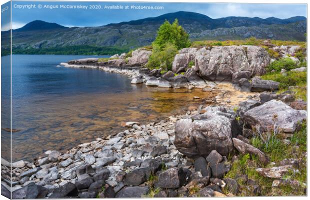 Rocky shoreline of Loch Maree Canvas Print by Angus McComiskey