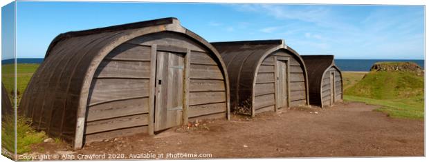 Upturned Boat Sheds on Holy Isle, Northumberland Canvas Print by Alan Crawford