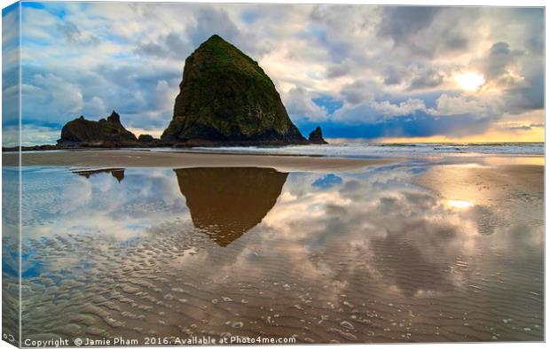 Cannon Beach with storm clouds in Oregon Canvas Print by Jamie Pham
