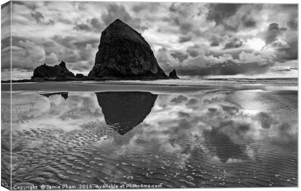 Cannon Beach with storm clouds in Oregon Canvas Print by Jamie Pham