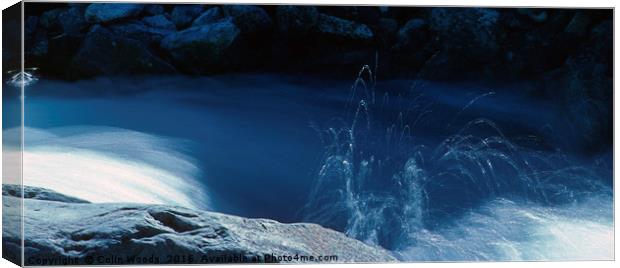 Water spraying in a mountain stream Canvas Print by Colin Woods