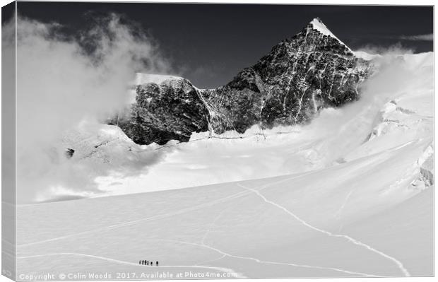 Climbers high in the Swiss Alps, on the traverse o Canvas Print by Colin Woods