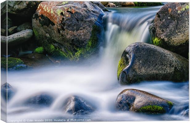 Waterfall and wet rocks Canvas Print by Colin Woods